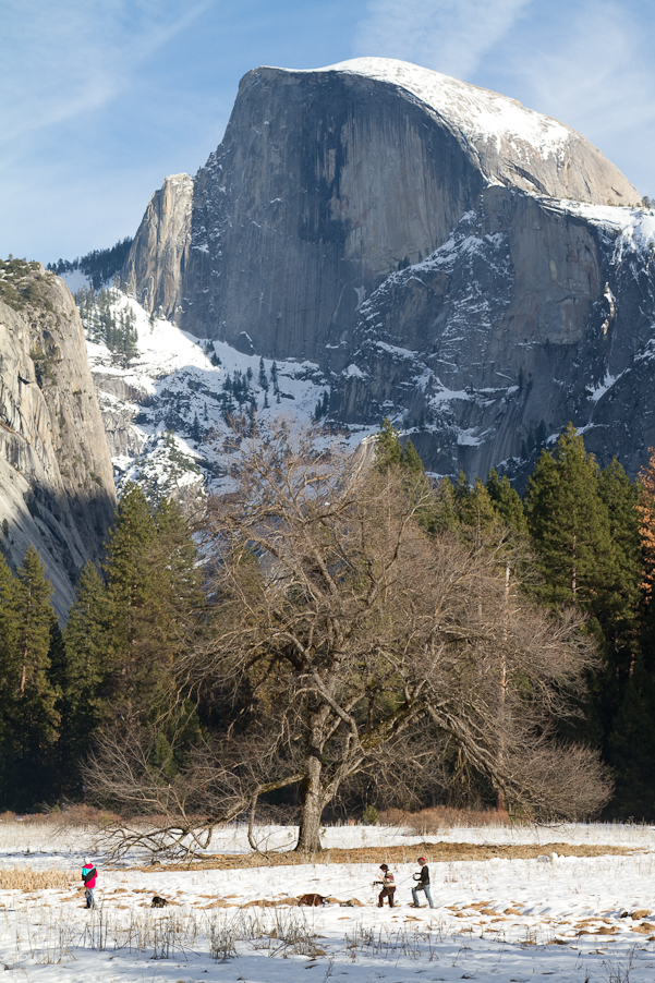 KIds playing in front of half dome at sunset.