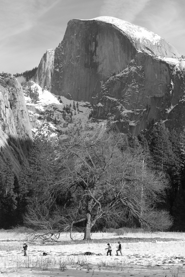 KIds playing in front of half dome at sunset.