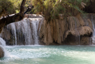 Local kids playing and swiming in the Luang Xi travertine waterfalls south of Louangprabang.