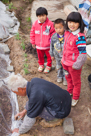 He Jia Xing, He Jia Fu, He Jia Yi helping YiFu ( their grandpa / Daisy's Mom's cousin's husband ) plant Sorghum.