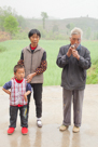 YiMa ( mama's cousin ), YiFu, and He Jia Fu in front of their new house