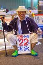 Youthful protest  — 24 Oct 2014, 6:30AM, Connaught Road, Central, Hong Kong, Benny Mok Hunger Striker on day 22 without food and feeling good.   Benny was still fasting after 40 days when he wisely decided to stop as not to 'one-up' god.