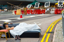 6:30 AM, Central Hong Kong.   guang ming lei luo, 光明磊落, means upright and honorable; and is used to describe people who are frank, transparent, and of an open mind.  It is also used to block the road.