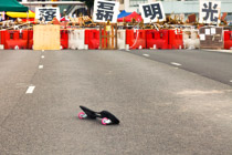 Youthful protest  —on Connaught Road, Hong Kong, speedlimit 50 km/hr
