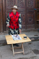 Duan Xiong Qui grew up in the guesthouse where we stayed and he is now the landlord.   He is a  lively and generous man giving gifts such as fresh carrots to everyone in town and for some reason wanted me to photograph him writing in front of his house.   He said he is not yet retired and still works as a farm laborer.
