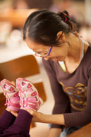 Daisy changing Valorie's stinky diaper