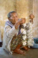 Lady selling flowers at the golden, 1000 year old Shwezigon Pagoda in Bagan which enshrines a bone and tooth of Buddha. (35mm Kodak Portra 160)