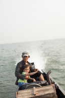 Brian helping SanRei drive our longboat (5d)