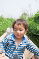 Brian on a row boat in a floating tomato field in the middle of Inle lake (5d)
