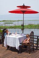 The deck of our hotel in the middle of the lake.   Banana milk shakes are a mainstay. (5d)