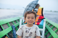 Tired eyes on a fast boat - we did a lot on this holiday (5d)