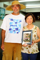 Photo taken by Peggy Lui of granddaughter of Mr. Mak, Mi Yip with me in Mr. Mak's shop after he passed away.