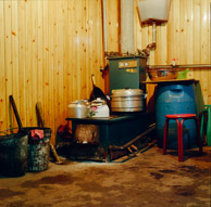 Homes use coal stoves which also heat oil which circulates into radiator heating throughout the house(501c Portra 800)